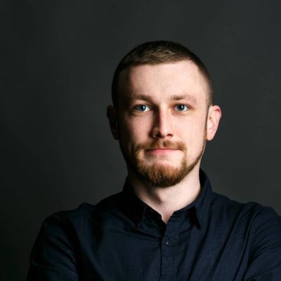 dark-blonde-bearded-man-crosses-his-hands-chest-posing-black-shirt (1) (1)